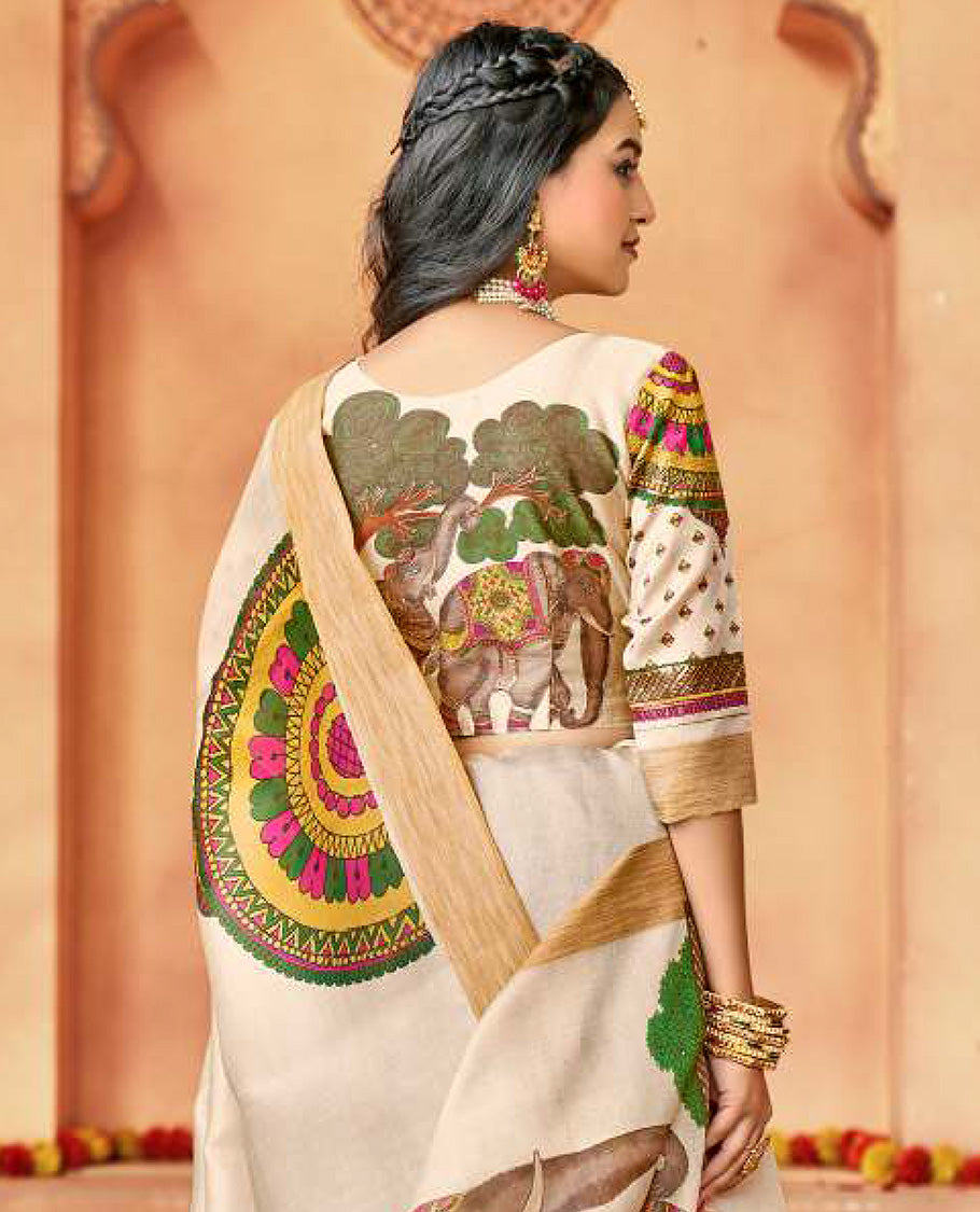 Cream designer catalog saree features Onam pookalam and elephant motifs, bavanji border, and elephant motif pallu