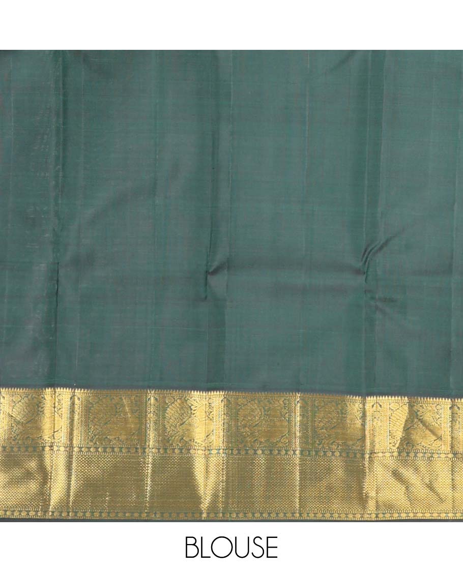 Orange chakram buttas Kanchipuram korvai silk saree, contrast neer korvai border of rekku, muthu, mayil, chakram, poun, and kuyil kann designs, and jaal pallu
