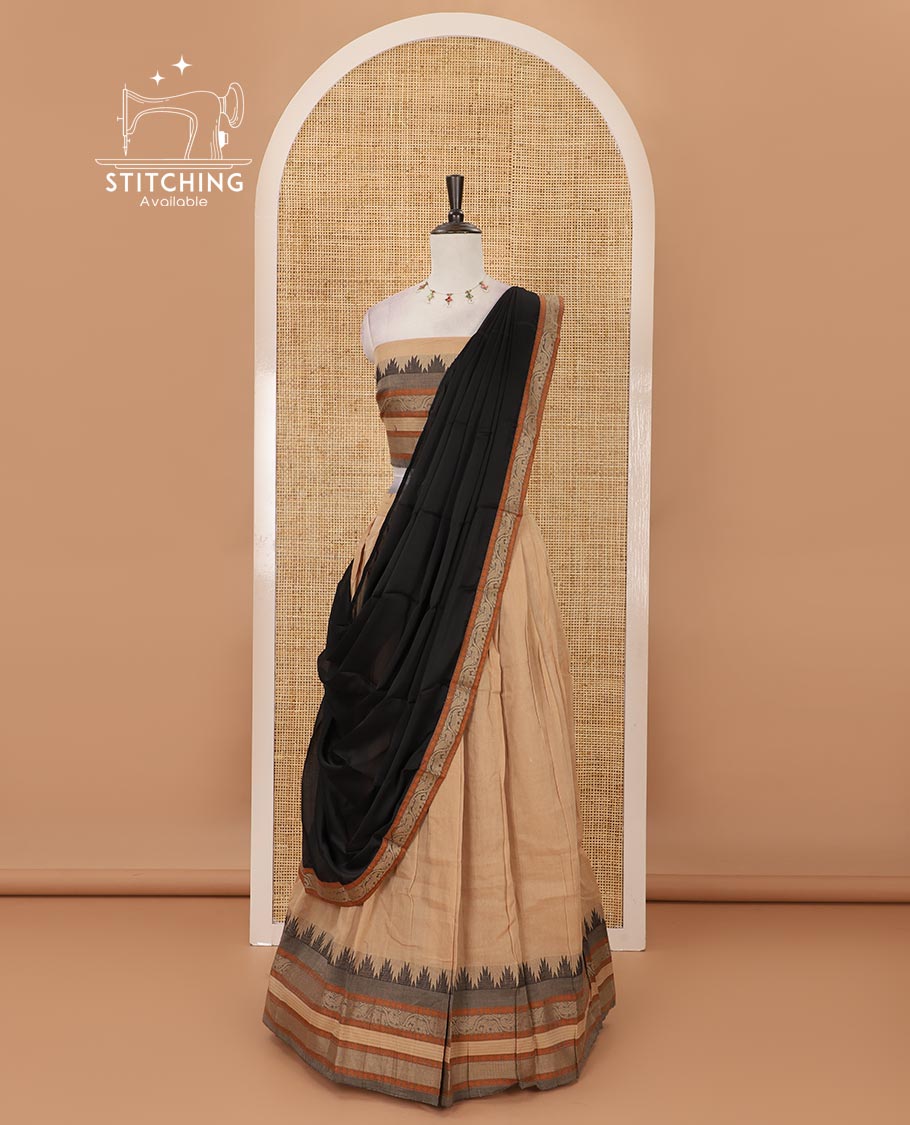 Chikku mercedised cotton half-saree, contrast traditional resham thread border skirt, matching blouse & contrast green thread border georgette dhavani