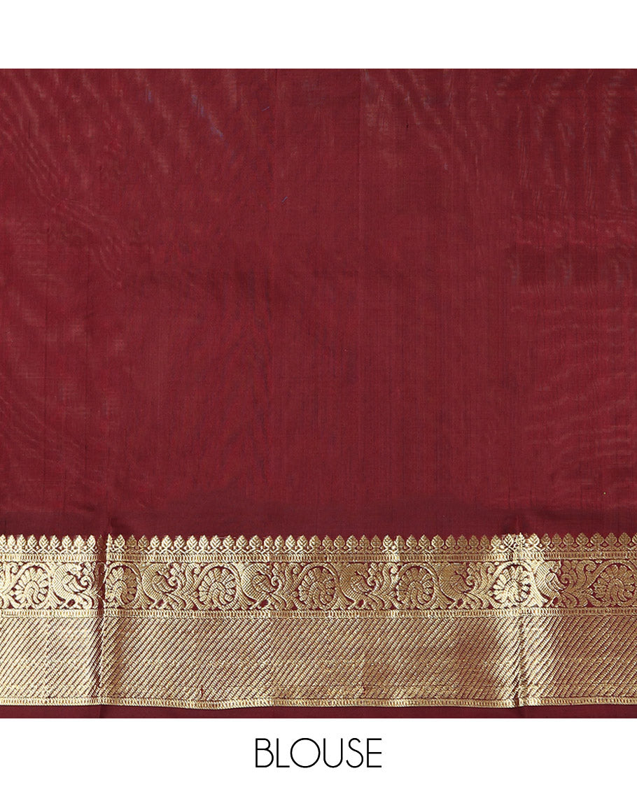 Green Venkatagiri Silk Saree, Delicately Woven with Zari Butta and Chevron Stripes All Over Its Body, Complemented by a Contrast Traditional Zari Border, Pallu of Ogee Designs, and Paired with a Contrast Blouse
