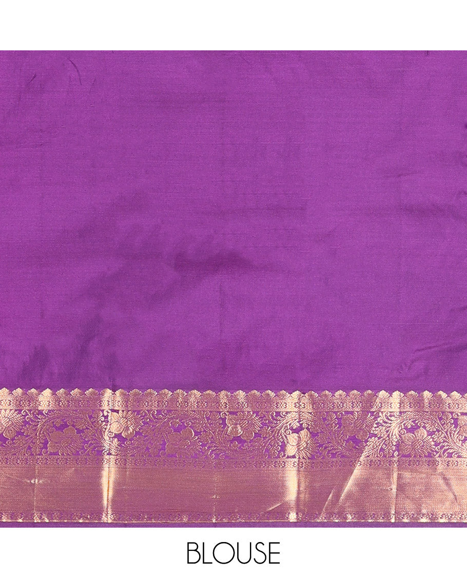 Purple Budget Silk Saree Detailed with Zari Buttas All Over Its Body, Highlighted by a Zari Traditional Border of Floral Creeper Designs, Grand Pallu of Scallop Designs, and Paired with a Matching Blouse