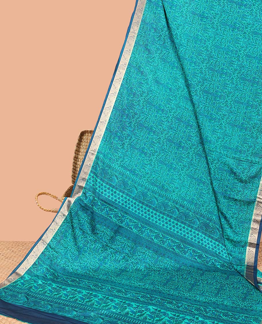 Blue intricately printed semi-banaras printed saree, contrast floral & paisley border & floral design pallu