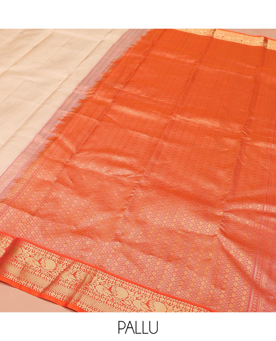 Sandal Vasundhara Silk Saree, Sparsely Woven with Zari Buttas on Its Body, Complemented by Contrast Border of Rudraksham, Mayil, Chakram, Muthu, and Mayil Kann Designs, Grandly Decked Up Pallu, and Paired with a Contrast Blouse