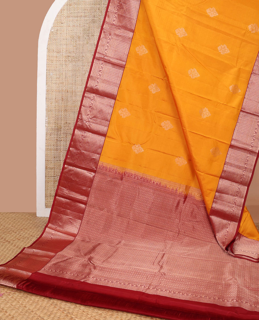 Orange buttas silk saree with contrast border of thilakam mokku, muthu, banaras design & jaal pallu