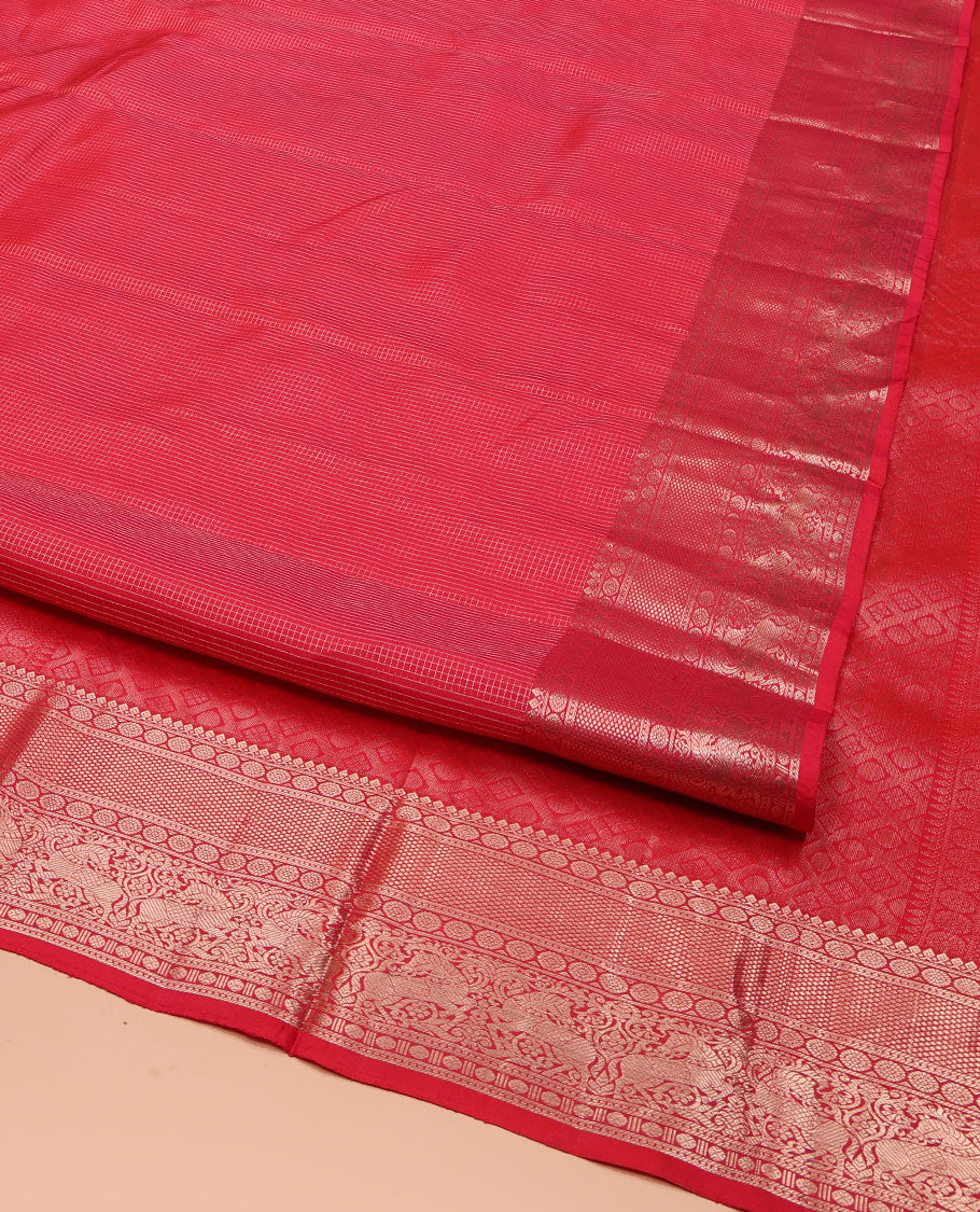 Red Vasundhara Silk Saree, Subtly Sparkled with Zari Checks All Over Its Body, Highlighted by Zari Border of Thilakam Mokku, Kamalam, Mayil Kann, Rudraksham, and Kuthirai Designs, Pallu of Jaal Designs, and Paired with a Matching Blouse