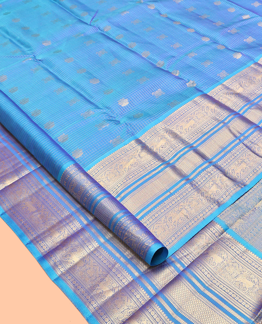 Blue Iruthalai Pakshi and Checked Kanchipuram Silk Saree, a Zari Border of Rekku, Kathir, Rudraksham, Yaali, Mayil Kann, Neli, Kamalam and Mayil Designs, Jaal Pallu, and a Matching Blouse
