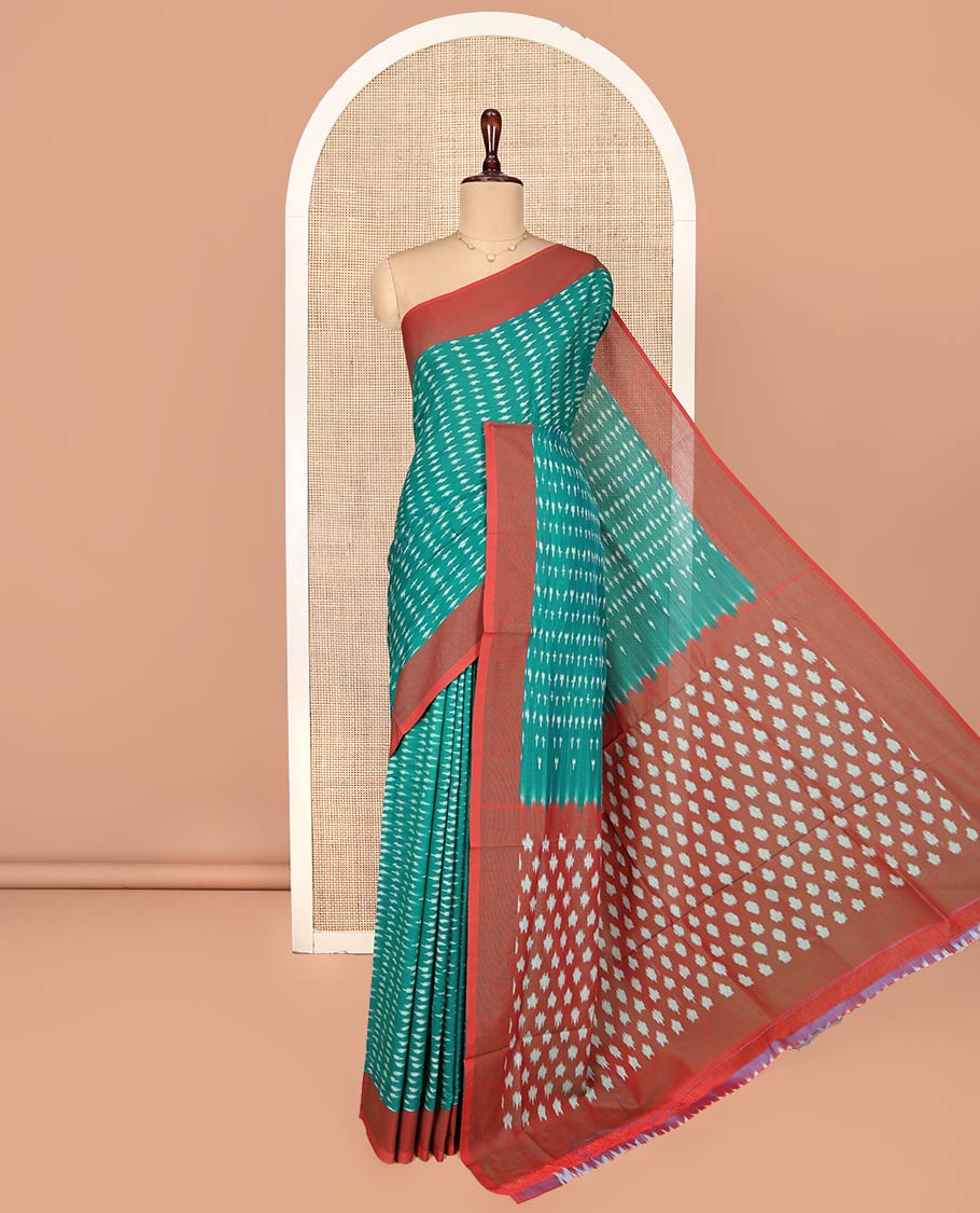 Green Ikkat Cotton Saree, Steeped with Ikkat-Style Buttas on Its Body, Complemented by a Contrast Border, Pallu Steeped with Ikkat-Style Buttas, and Has No Blouse