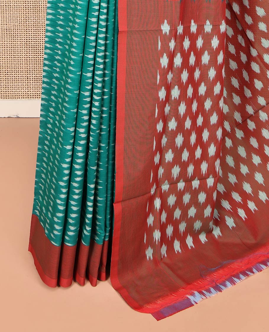 Green Ikkat Cotton Saree, Steeped with Ikkat-Style Buttas on Its Body, Complemented by a Contrast Border, Pallu Steeped with Ikkat-Style Buttas, and Has No Blouse