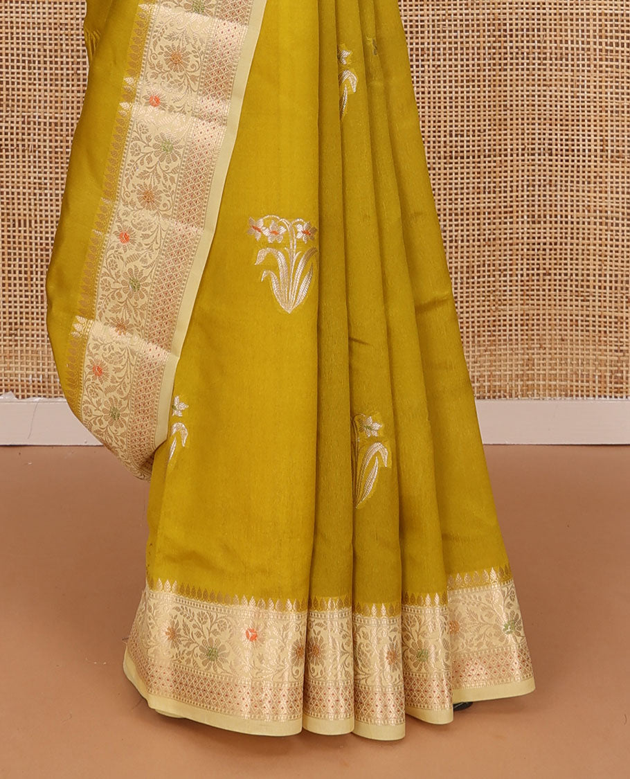 Green floral buttas raw mango silk saree, contrast traditional zari design border, and intricate pallu