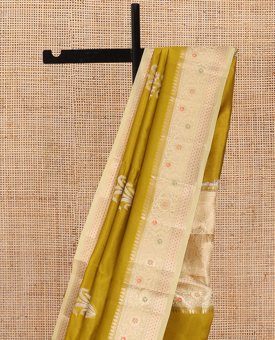 Green floral buttas raw mango silk saree, contrast traditional zari design border, and intricate pallu