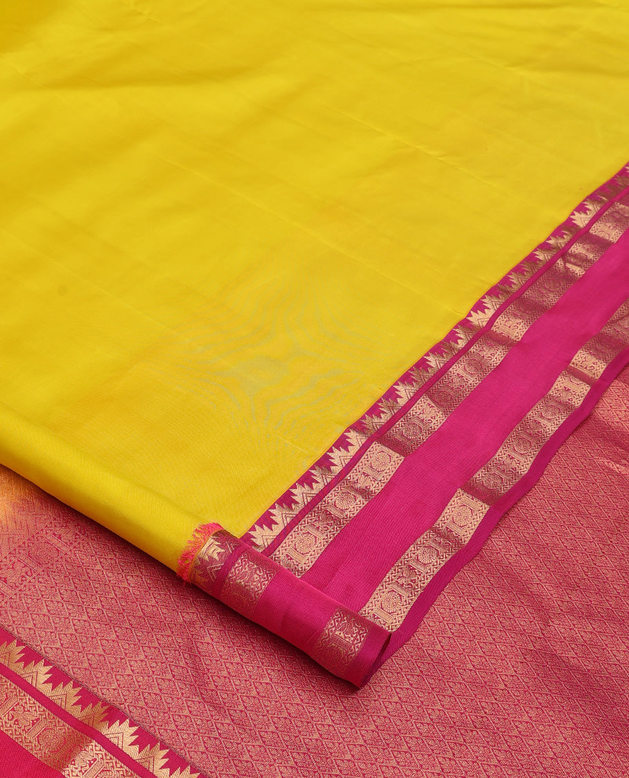 Lemon yellow plain Kanchipuram silk saree, contrast rettai pettu border of thazampoo rekku, neli, poo chakram, and kuthirai designs, and jaal pallu
