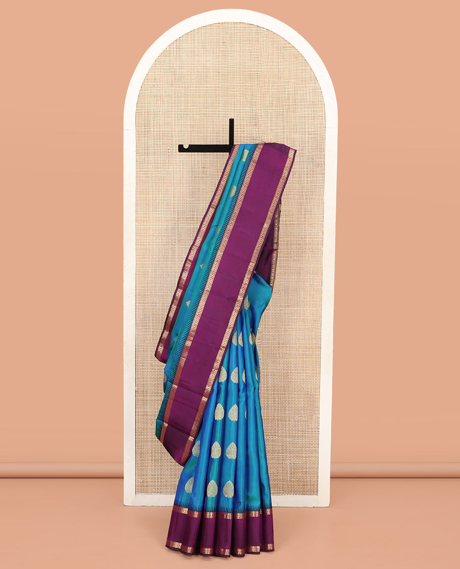 Blue Vasundhara Silk Saree, Delicately Woven with Zari Buttas All Over Its Body, Complemented by a Contrast Rettai Pettu Temple Border of Banaras, and Manga Designs, Grand Jaal Pallu, and Paired with a Contrast Blouse