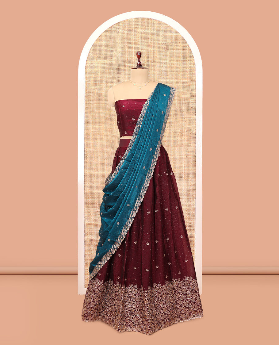 Wine Banarasi Half-Saree, Opulently Embellished with Embroidered Skirt, a Floral Embroidered Border, a Matching Blouse, and Contrast Scallop Embroidered Dupatta