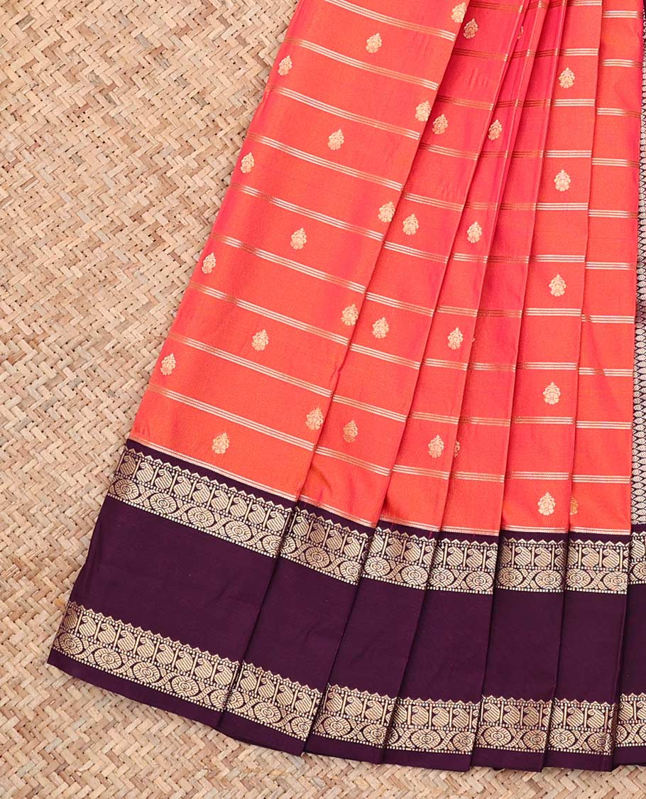Dark Peach Budget Silk Saree, Gleamed up with Zari Buttas and Zari Stripes All Over Its Body, Complemented by Contrast Rettai Pettu Traditional Zari Designs Woven Border, Grand Jaal Pallu and Paired with a Contrast Blouse