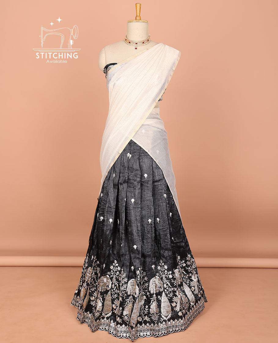Black floral embroidered half saree with self embroidered border, floral embroidery blouse & floral buttas , scallop border dhavani