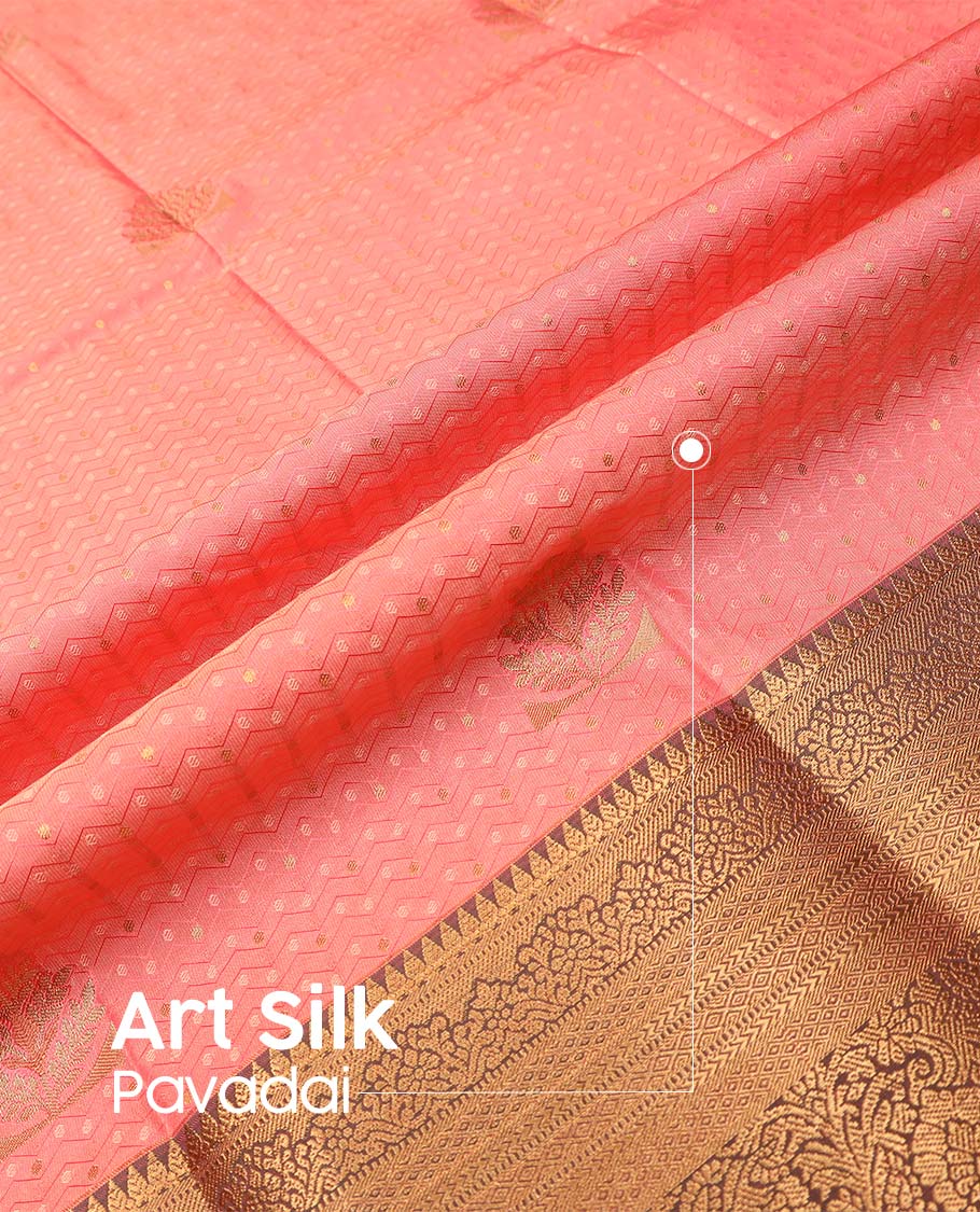 Peach art silk pavadai material, embossed with zari buttas woven skirt, contrast traditional zari border, and blouse