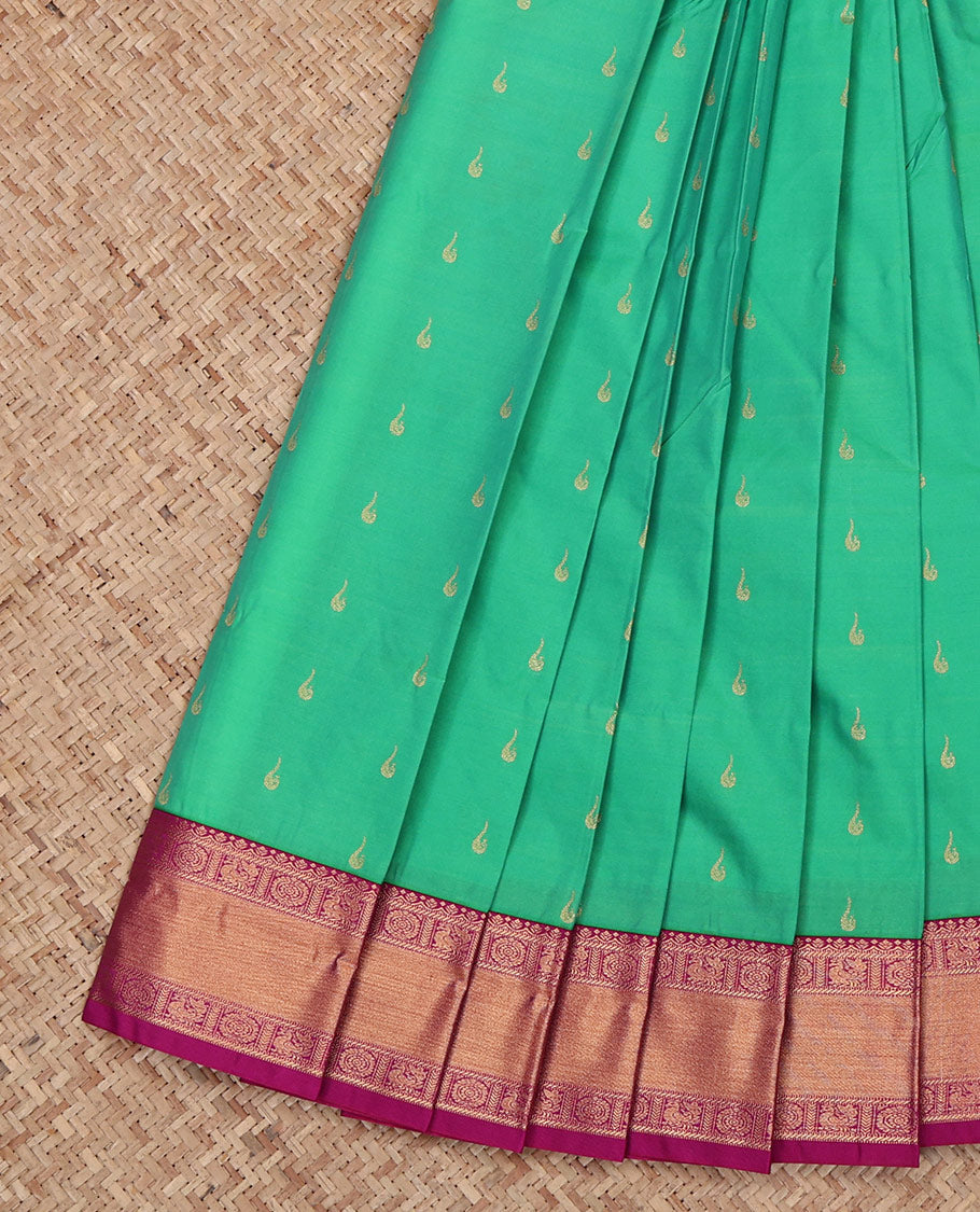 Green Budget Silk Saree, Sparsely Woven with Zari Buttas All Over Its Body, Complemented by a Contrast Traditional Zari Design Peacock-Chakram Border, Grand Pallu, and Paired with a Contrast Blouse