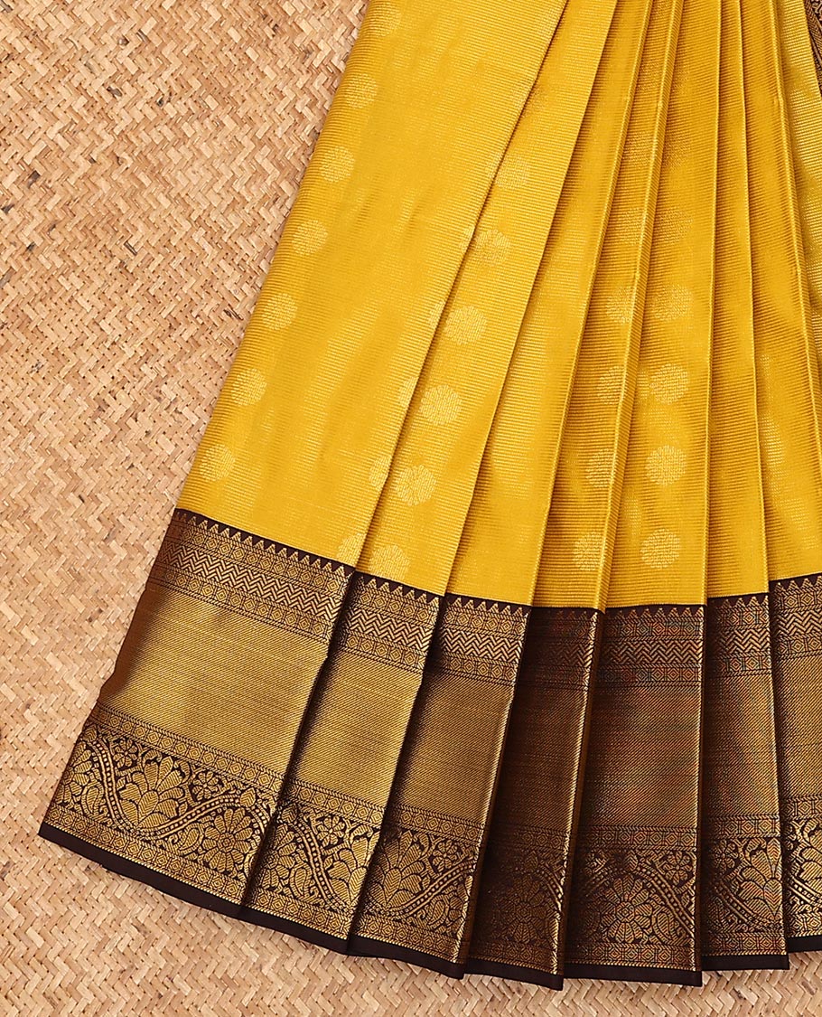 Yellow zari buttas, and striped gift saree, contrast traditional zari design border, and geometric patterned pallu