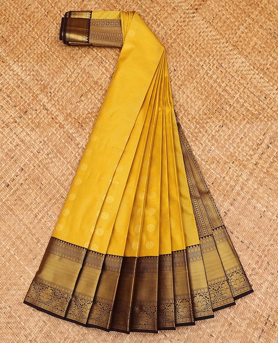 Yellow zari buttas, and striped gift saree, contrast traditional zari design border, and geometric patterned pallu