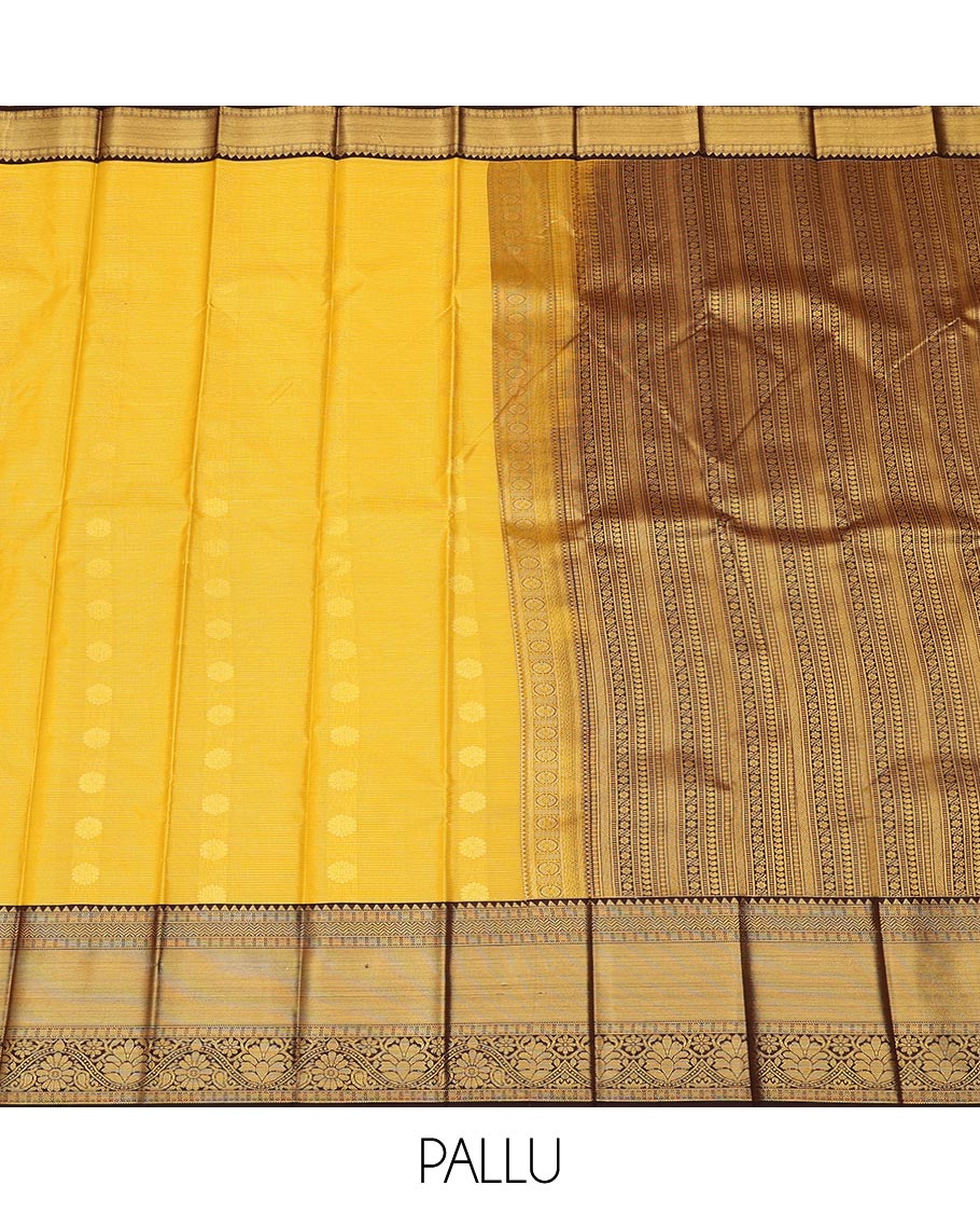 Yellow zari buttas, and striped gift saree, contrast traditional zari design border, and geometric patterned pallu
