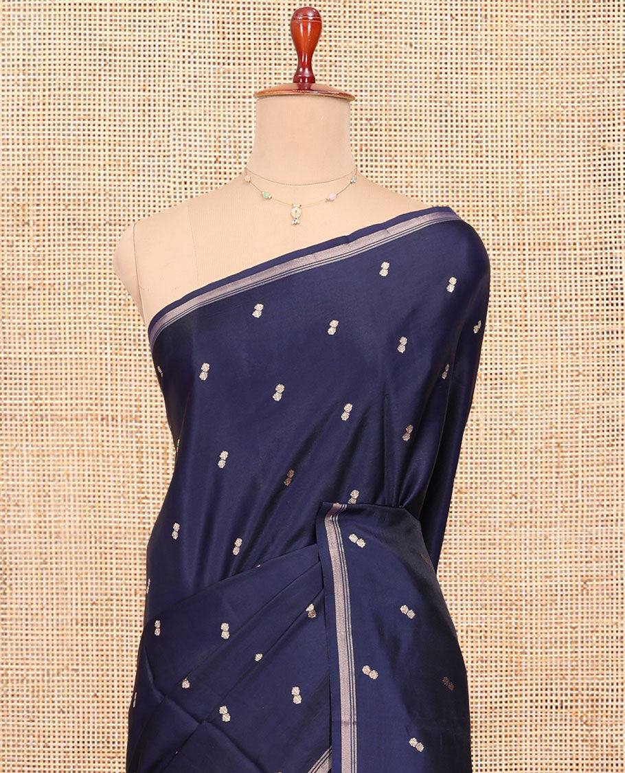 Navy Blue Satin Silk Saree, Delicately Woven with Buttas All Over Its Body, a Subtle Piping Border, Complemented by a Contrast Pallu of Floral-Paisley Designs in Zari, and Paired with a Contrast Blouse
