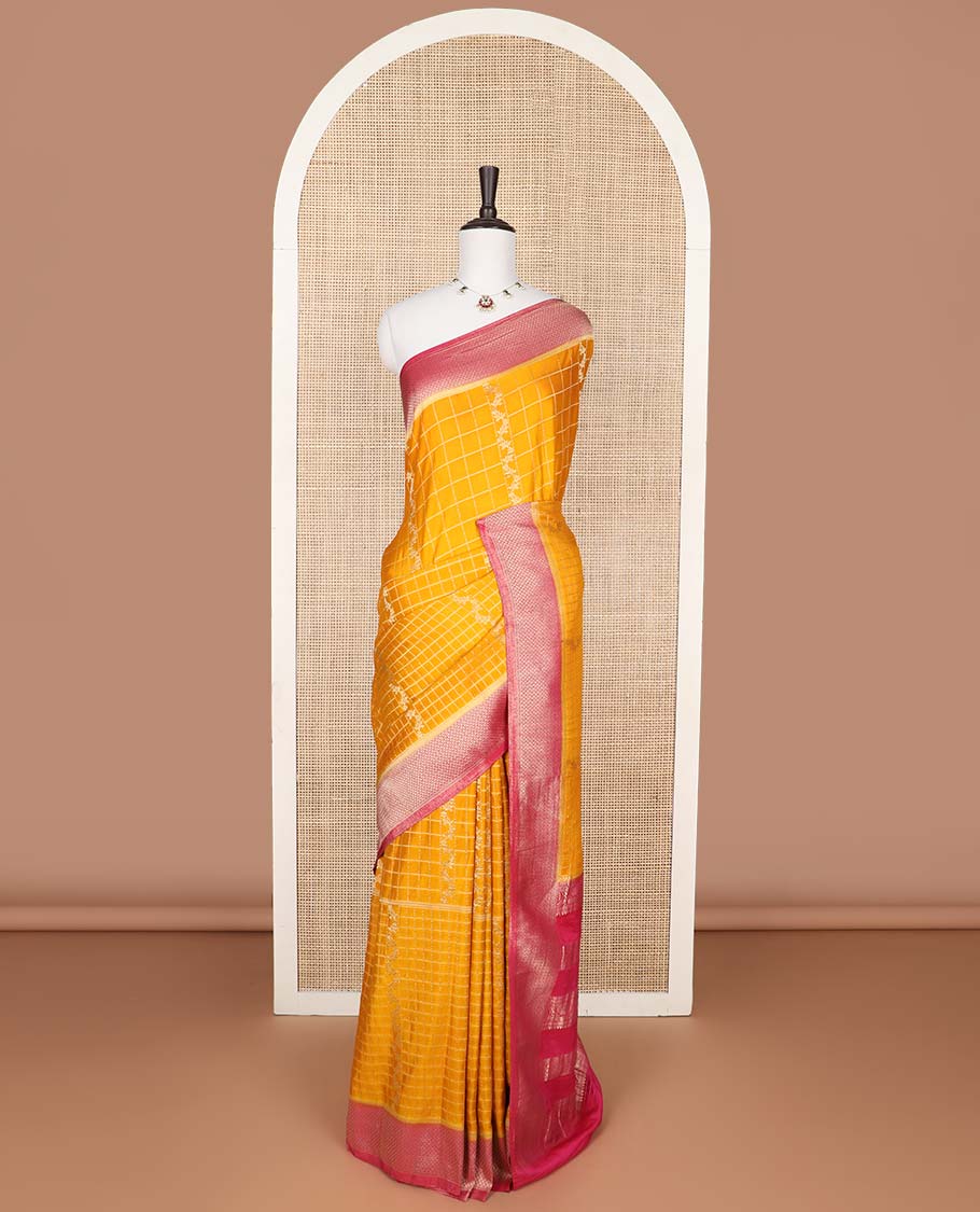 Orange checked fancy crepe saree with contrast checked border & floral design pallu