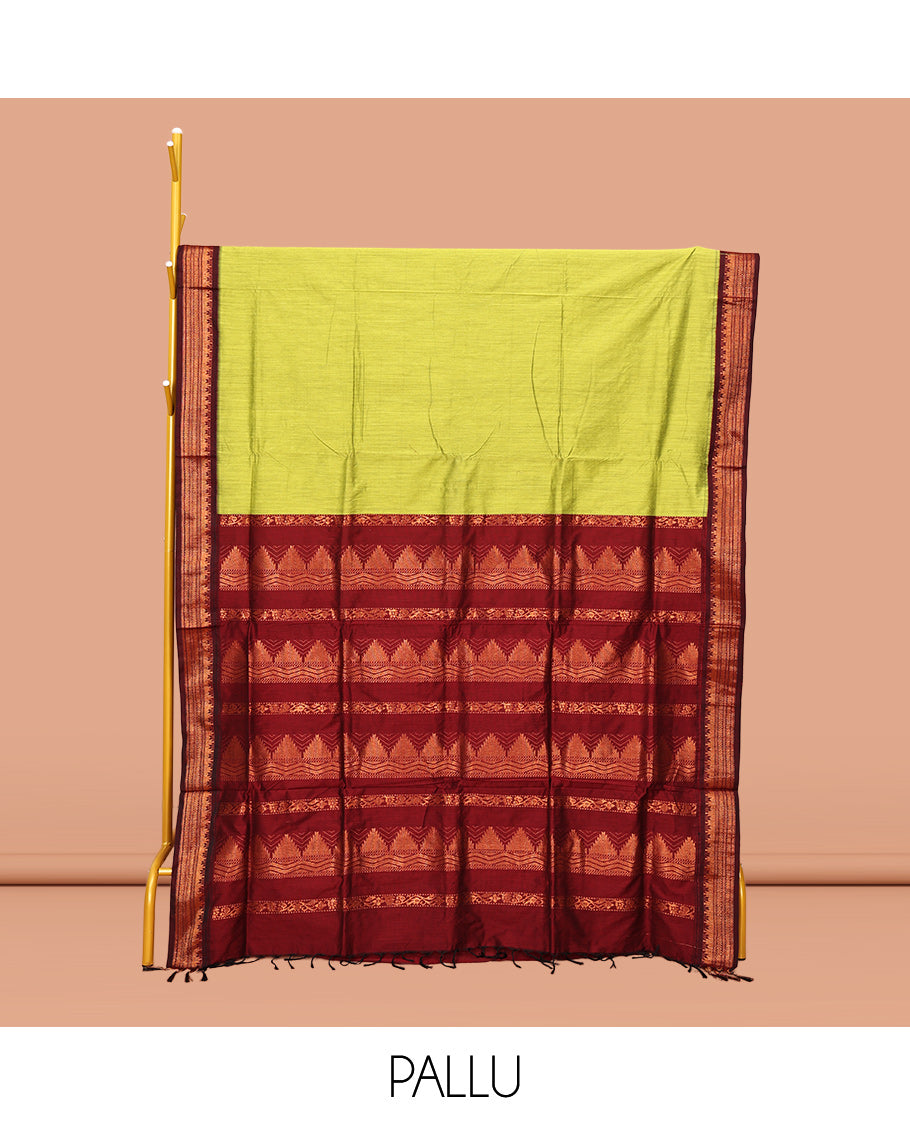 Light Green Plain Kalyani Cotton Saree, Complemented by a Contrast Traditional Zari Design Temple Border, Pallu Features Temple Zari Designs, and Paired with a Contrast Blouse