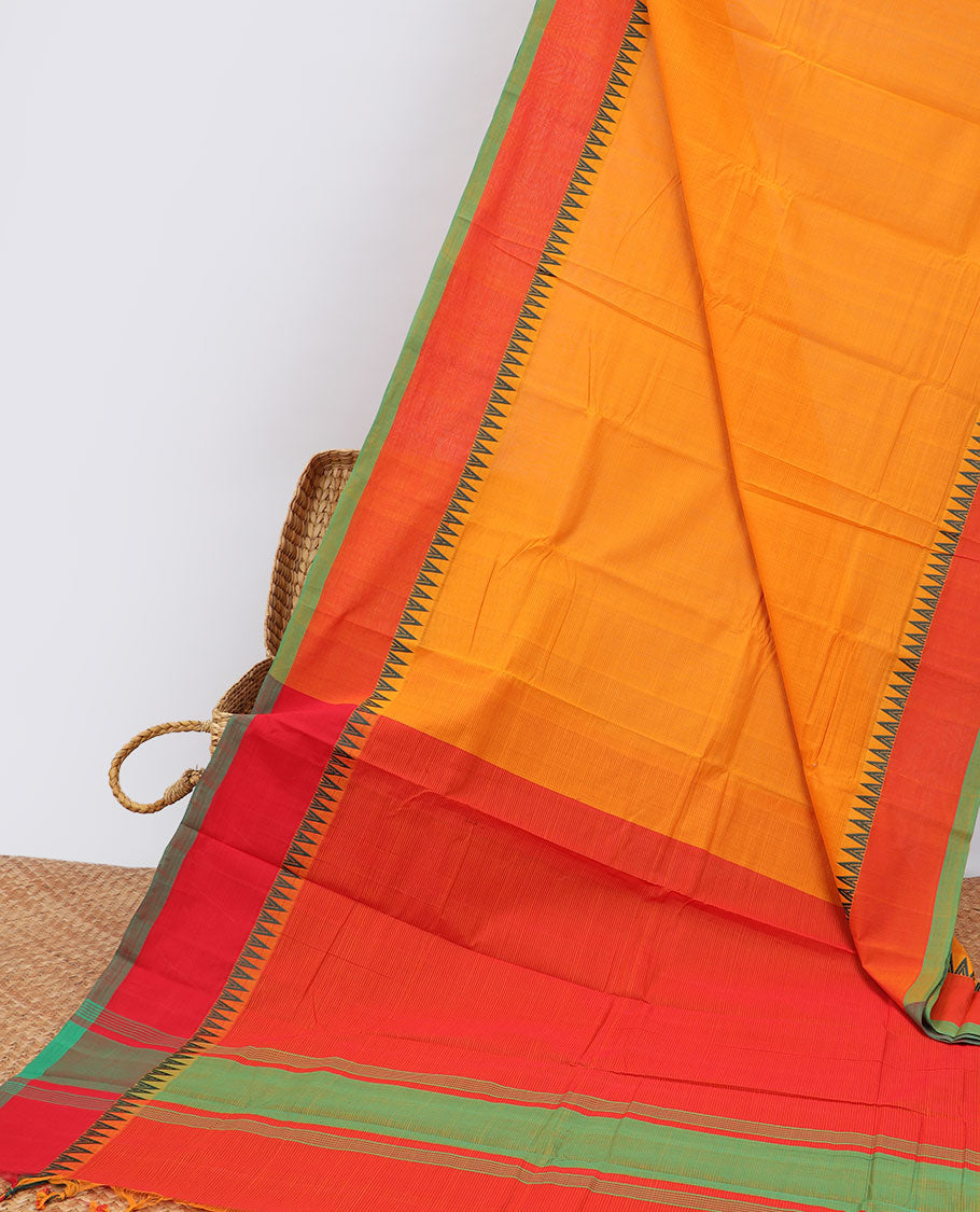 Orange khadi cotton saree with contrast temple border & striped pallu