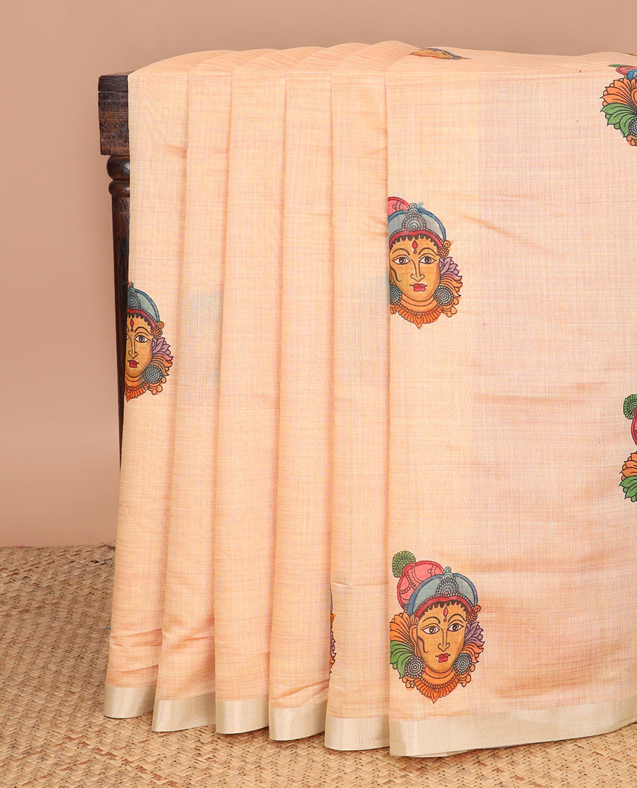 Pale orange kalamkari buttas printed chirala cotton saree, bavanji border, and contrast chakram motifs print pallu