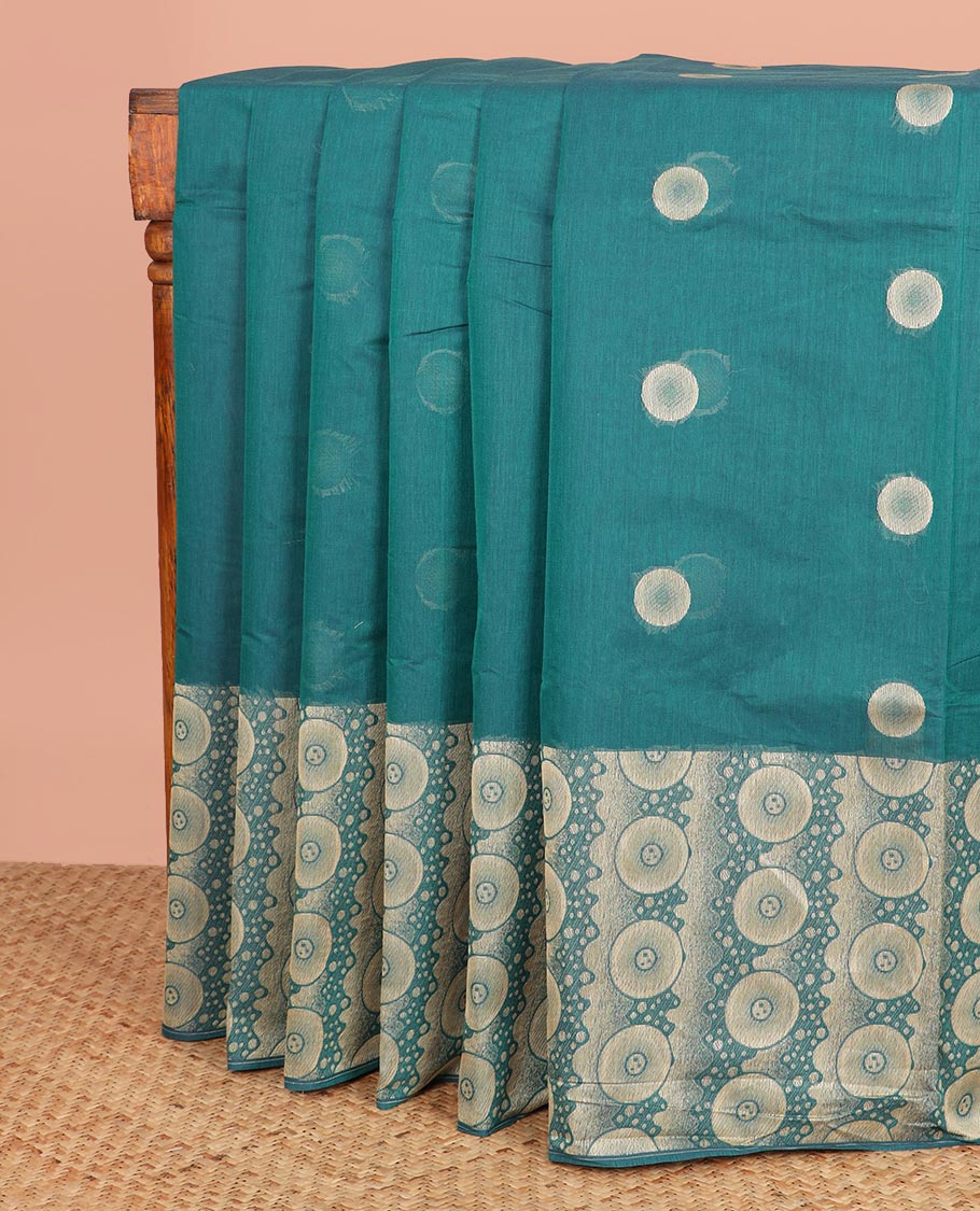 Green Coimbatore Cotton Saree, Beautified with Circle Buttas All Over Its Body, Subtly Made Border Steeped with Circle Designs, Pallu Mirrors the Same Body Design, and Paired with a Matching Blouse