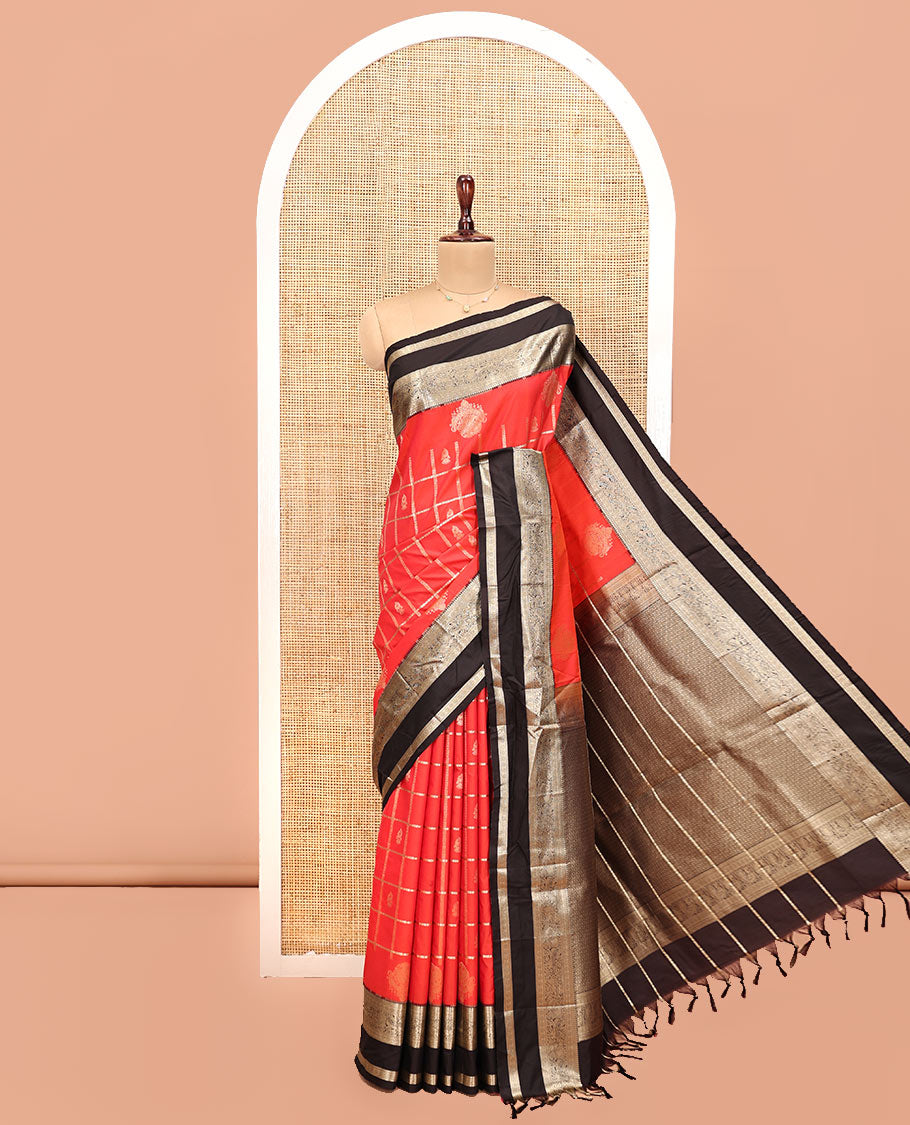 Reddish Orange Budget Silk Saree, Entralled with Jhumka Butta Enclosed Checks On Its Body, Complemented by Contrast Traditional Zari Rettai Pettu Border, Grand Pallu and Paired with a Contrast Blouse