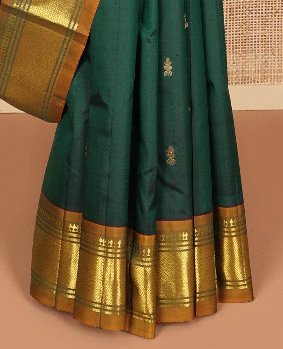 Bottle green buttas kancheepuram silk saree with contrast border of thilakam, mokku, banaras, kuyil kann design border & zari design pallu
