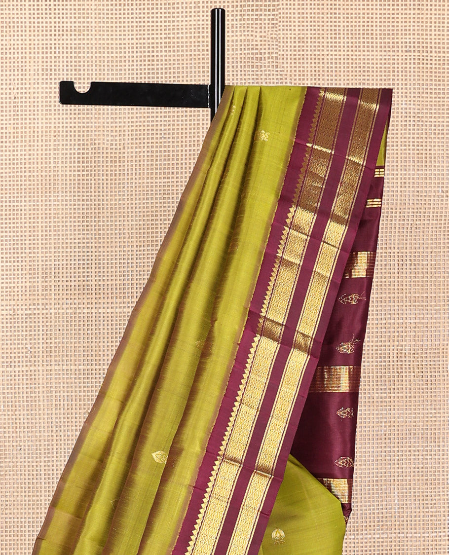 Green floral buttas kancheepuram silk saree with contrast korvai border of thilakam mokku, banaras, checked design & zari design pallu