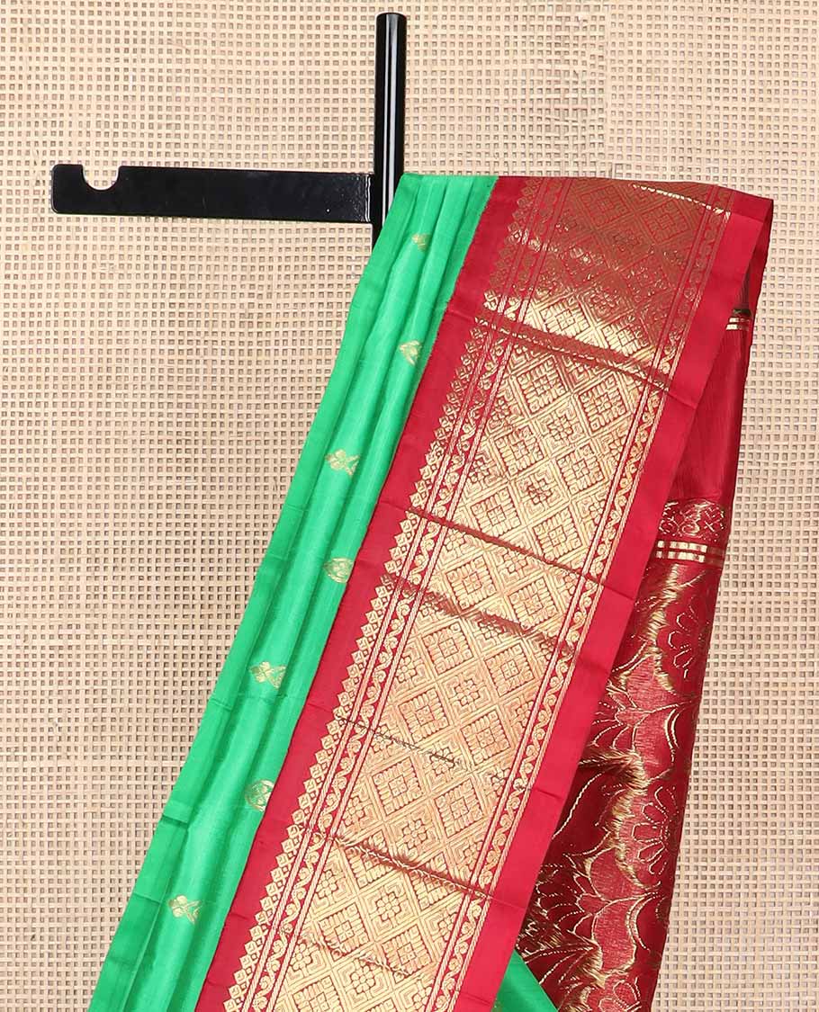 Green buttas kancheepuram silk saree with contrast korvai border of thilakam mokku, banaras design & floral pallu