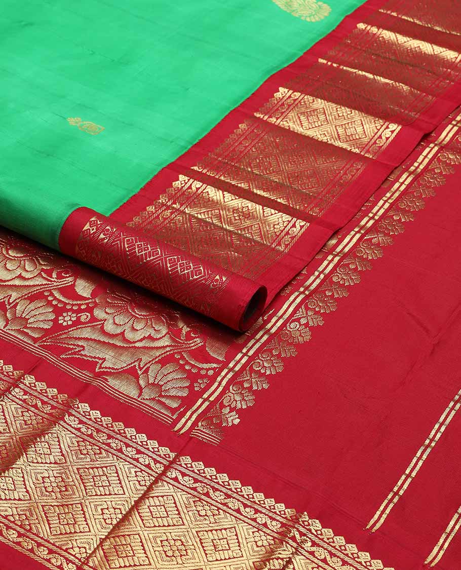 Green buttas kancheepuram silk saree with contrast korvai border of thilakam mokku, banaras design & floral pallu