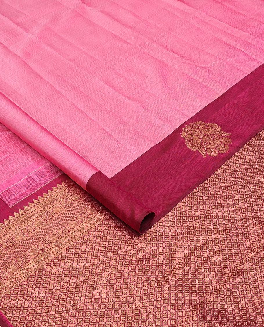 Pink zari woven Kanchipuram silk saree, contrast rettai mayil zari border, and jaal pallu