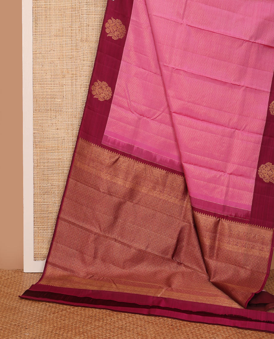 Pink zari woven Kanchipuram silk saree, contrast rettai mayil zari border, and jaal pallu