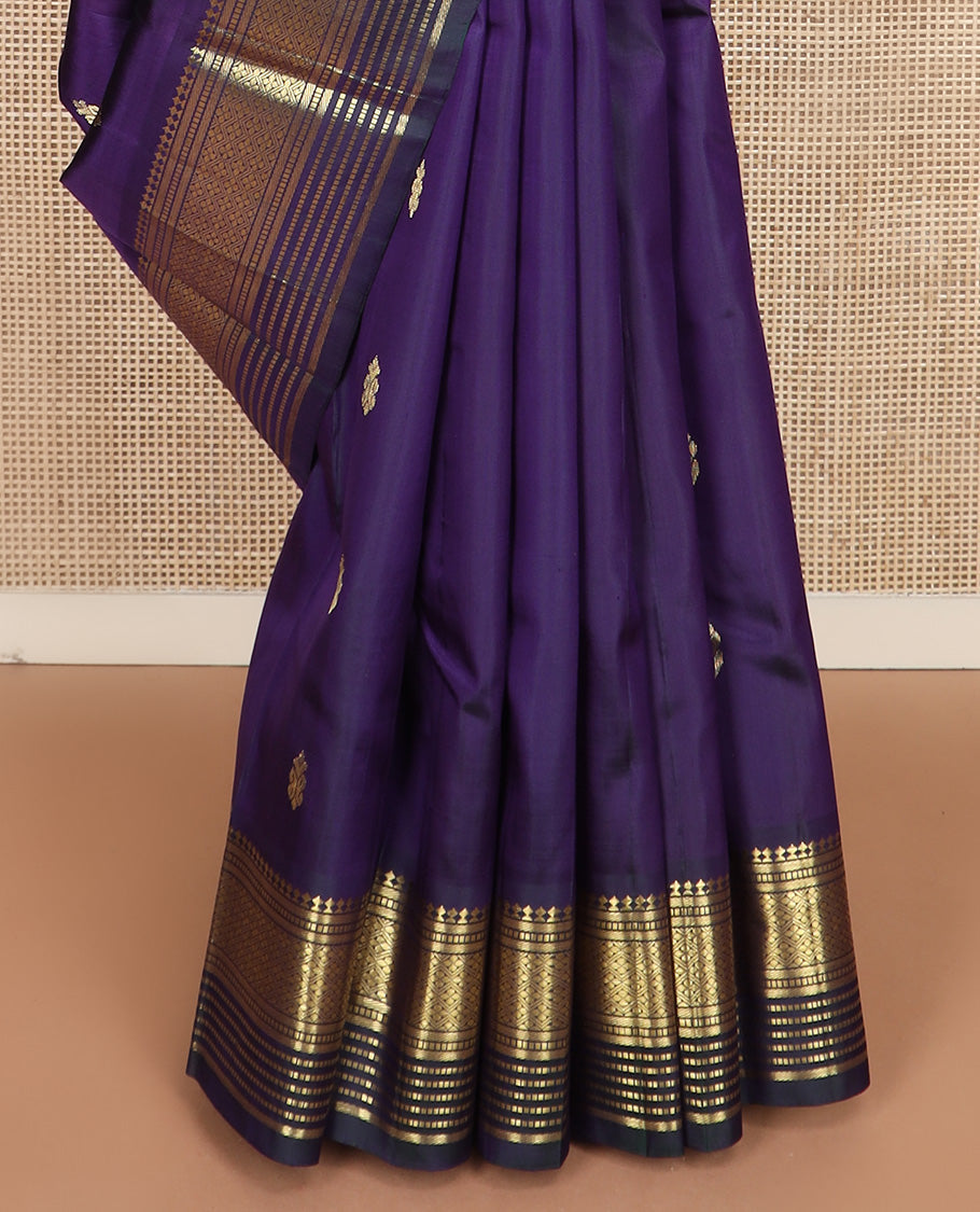 Blue zari buttas Kanchipuram silk saree, one-sided border of paneer sombu, banaras, muthu, and jaal design, and zari design pallu
