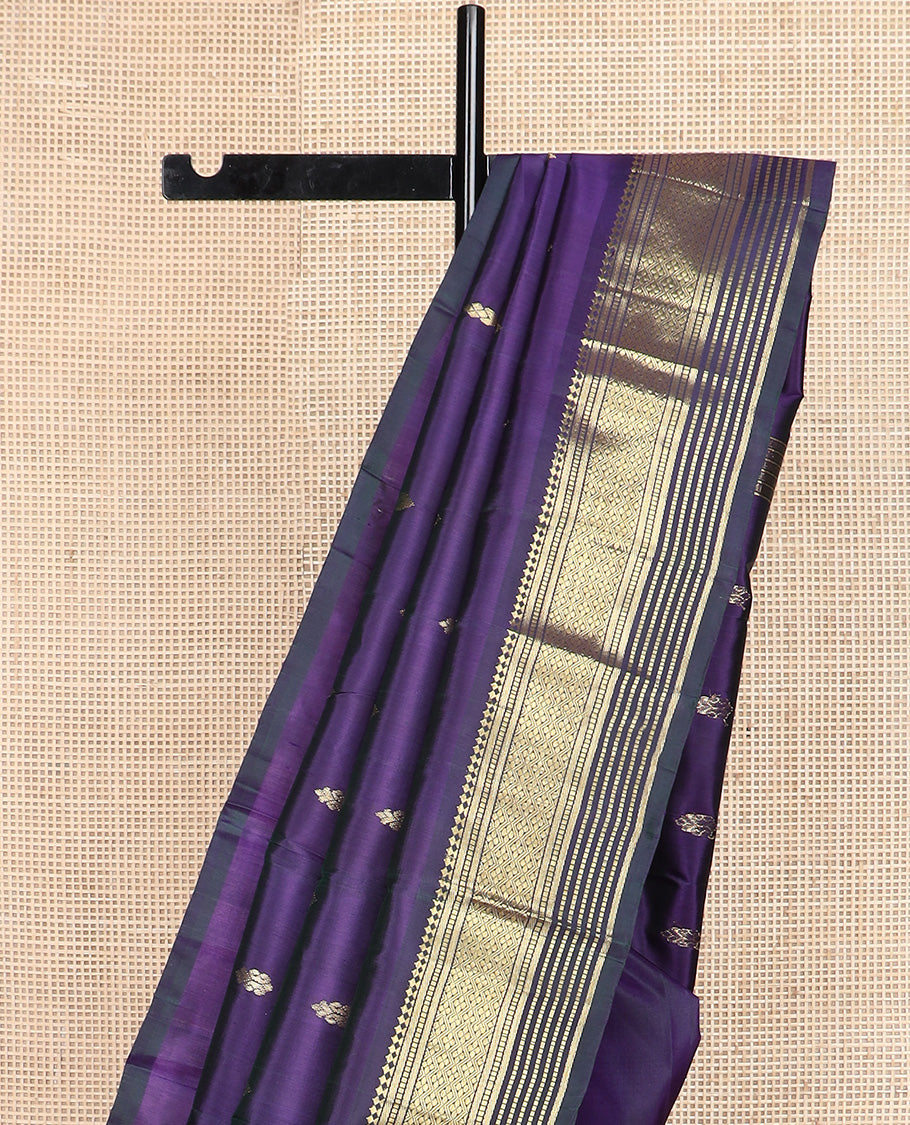 Blue zari buttas Kanchipuram silk saree, one-sided border of paneer sombu, banaras, muthu, and jaal design, and zari design pallu