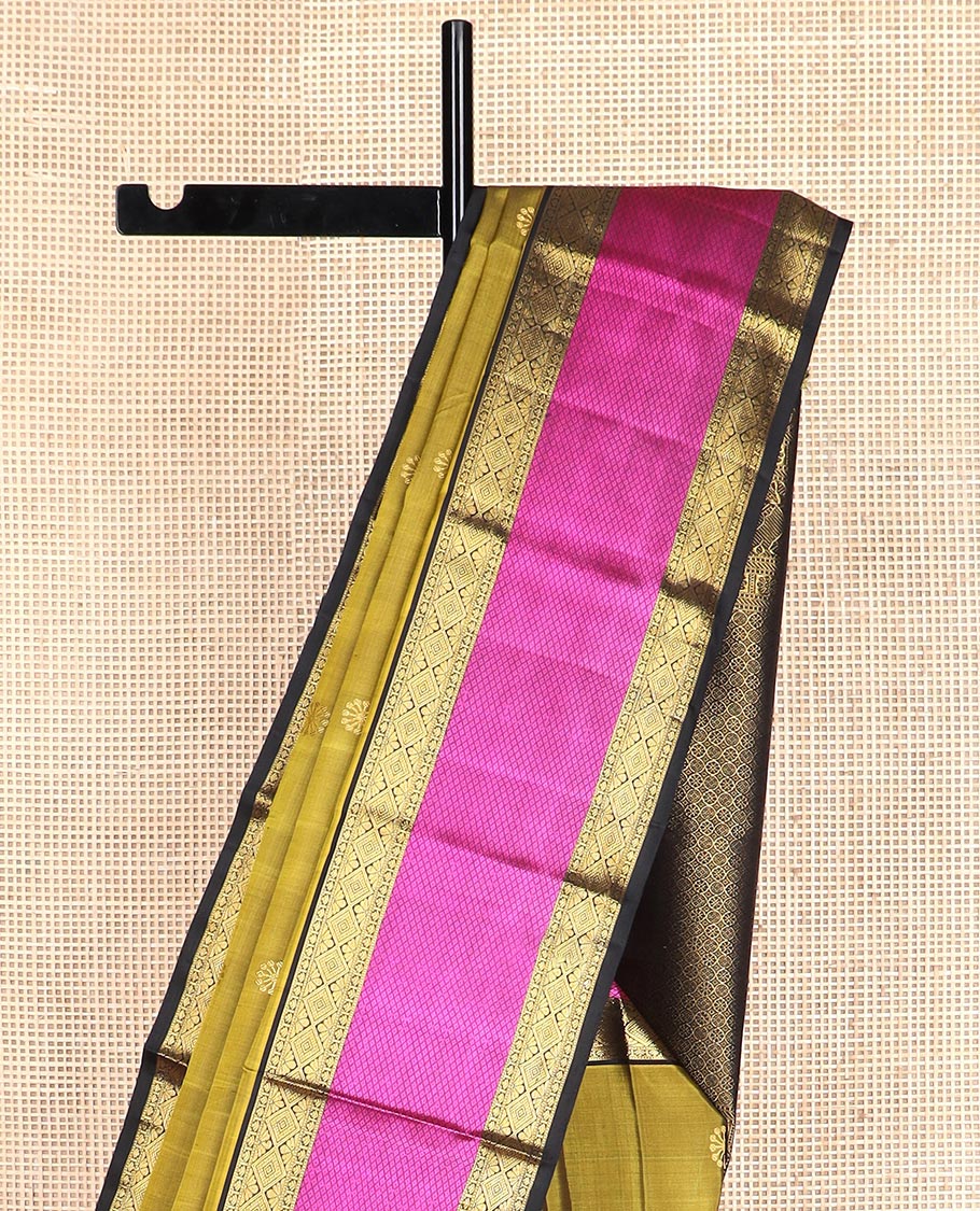 Green zari buttas Kanchipuram silk saree, contrast border of diamond, and mayil kann designs, and intricate pallu