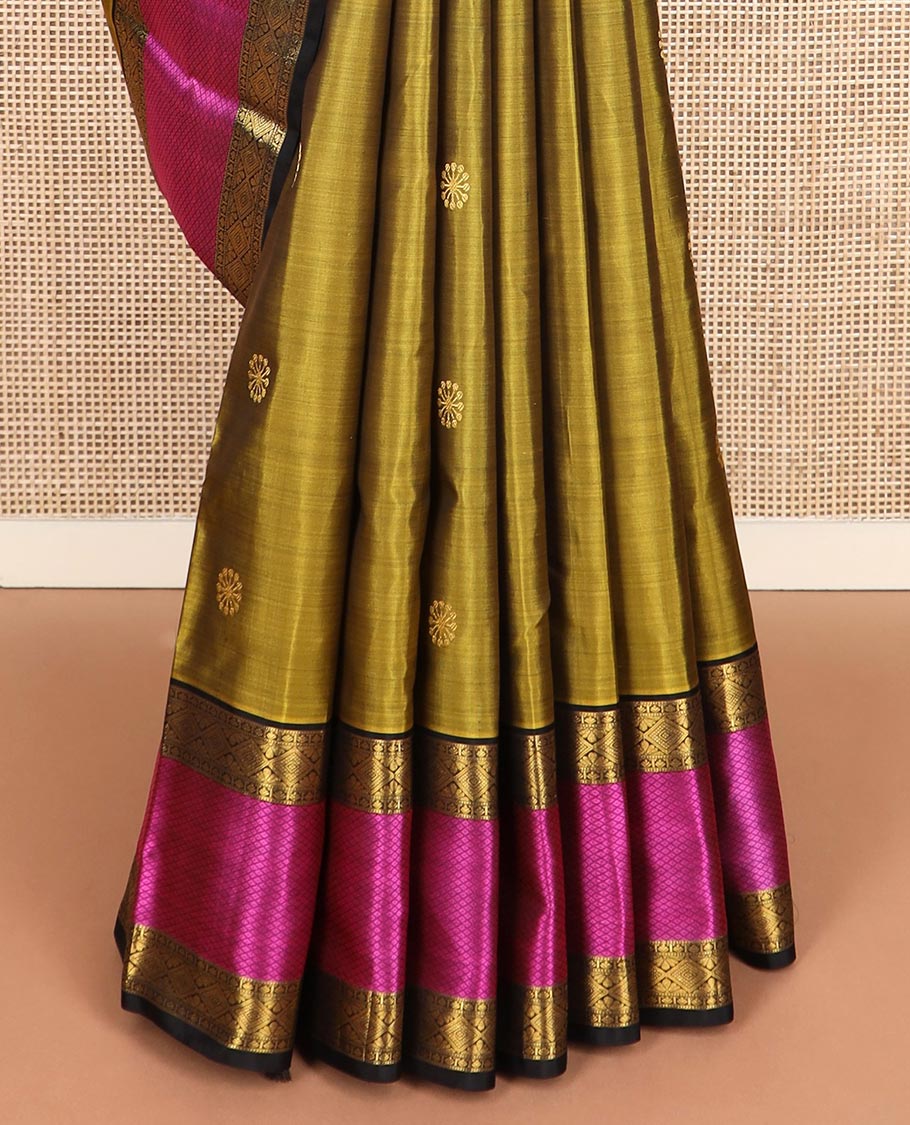 Green zari buttas Kanchipuram silk saree, contrast border of diamond, and mayil kann designs, and intricate pallu