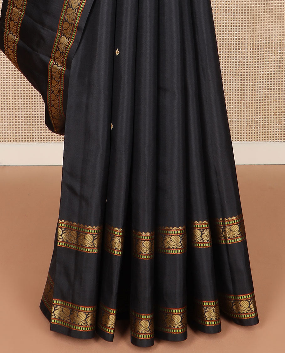 Black buttas Kanchipuram silk saree, rettai pettu border of rekku, muthu, and mayil designs, and jaal pallu
