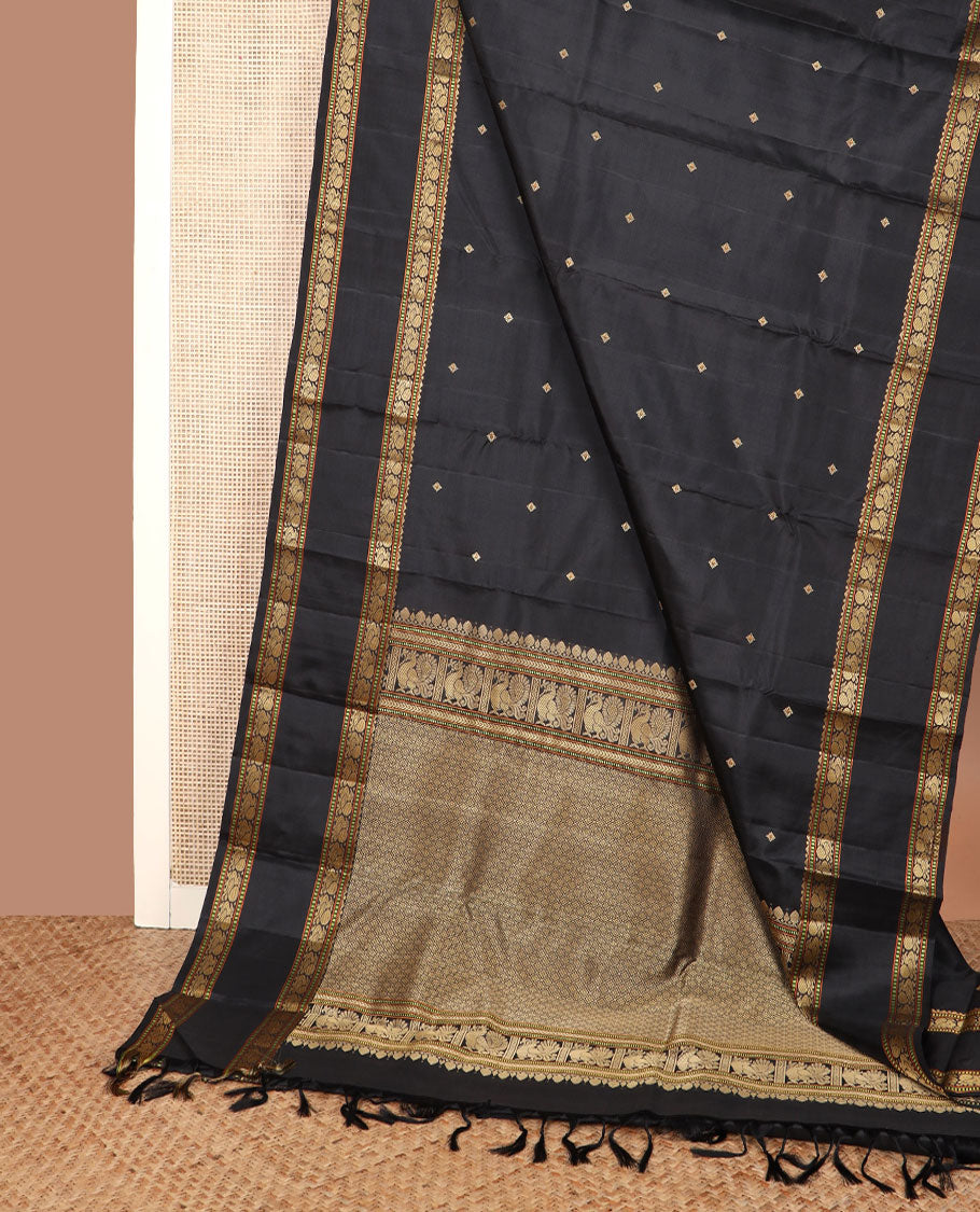 Black buttas Kanchipuram silk saree, rettai pettu border of rekku, muthu, and mayil designs, and jaal pallu