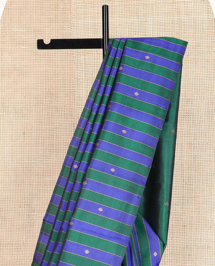 Borderless blue and green striped and buttas Kanchipuram silk saree, self-pallu features zari buttas