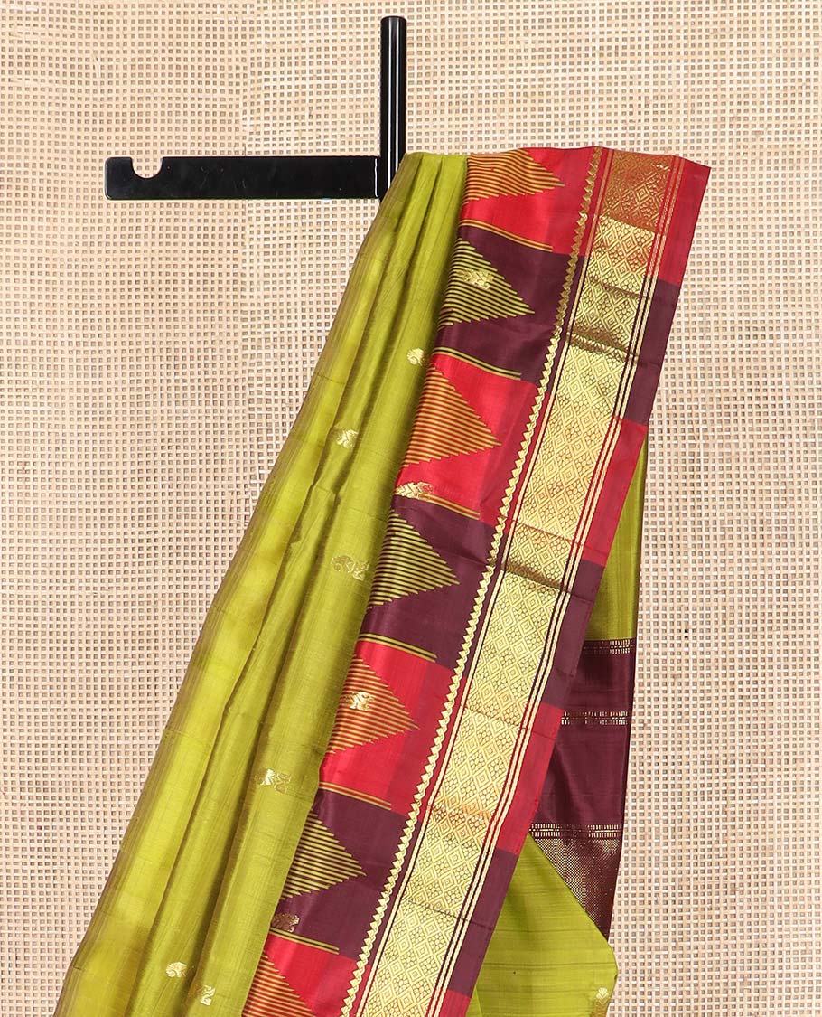 Green zari buttas Kanchipuram silk saree, contrast one-sided thazampoo rekku border of thilakam mokku, and jaal designs, and zari design pallu