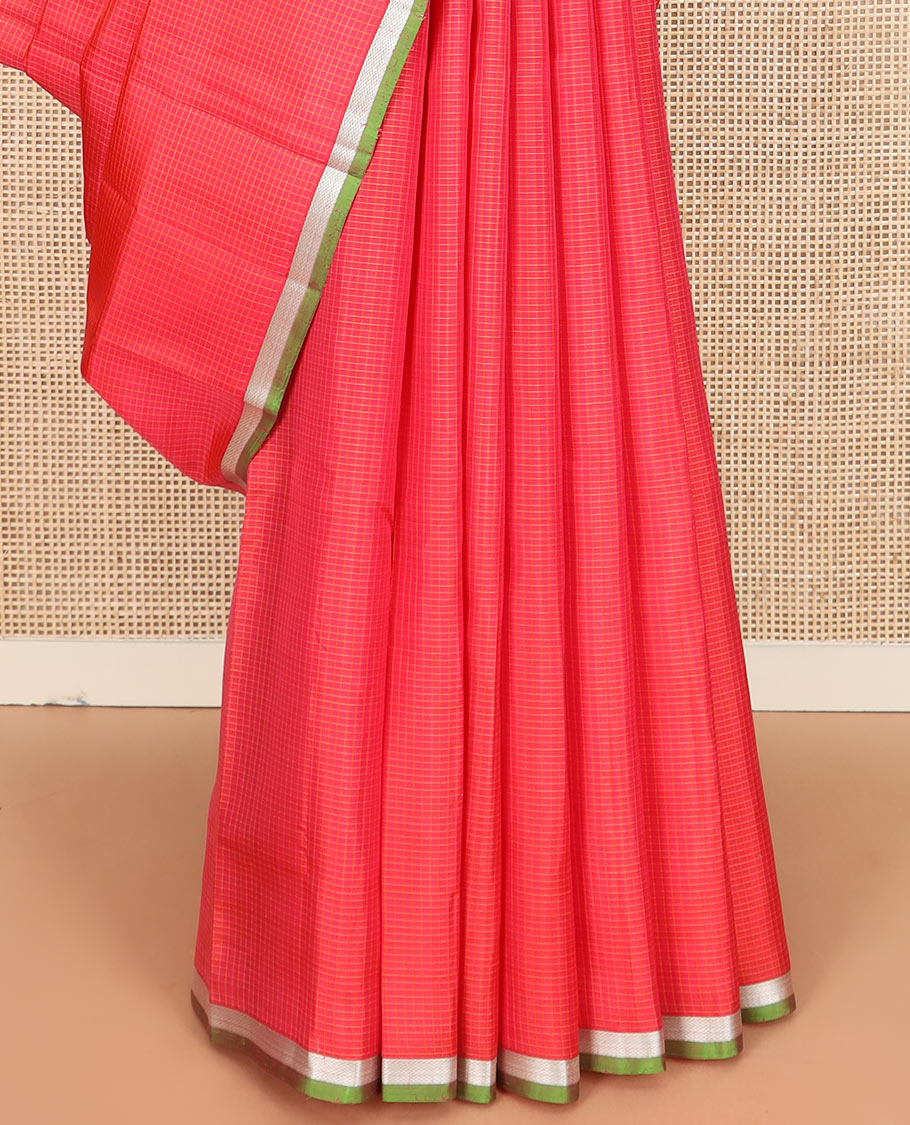 Red micro-checked Kanchipuram silk saree, contrast piping zari border of vanki designs, and striped pallu