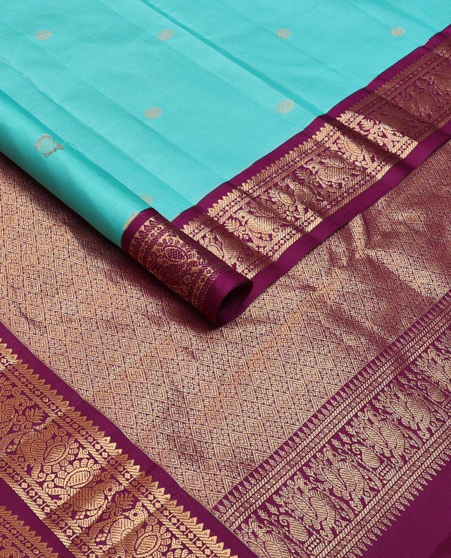 Light blue zari buttas silk saree, contrast border of rekku, diamond & mayil designs & jaal pallu