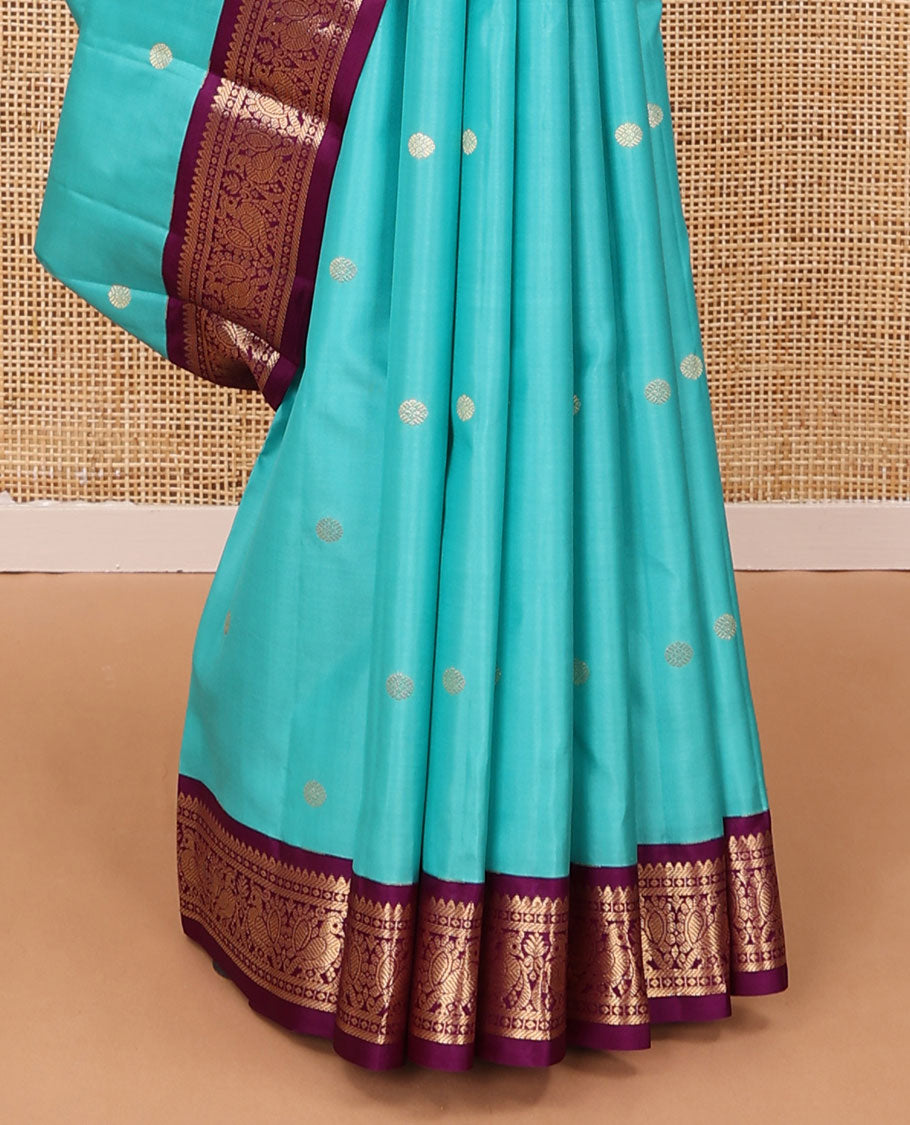 Light blue zari buttas silk saree, contrast border of rekku, diamond & mayil designs & jaal pallu