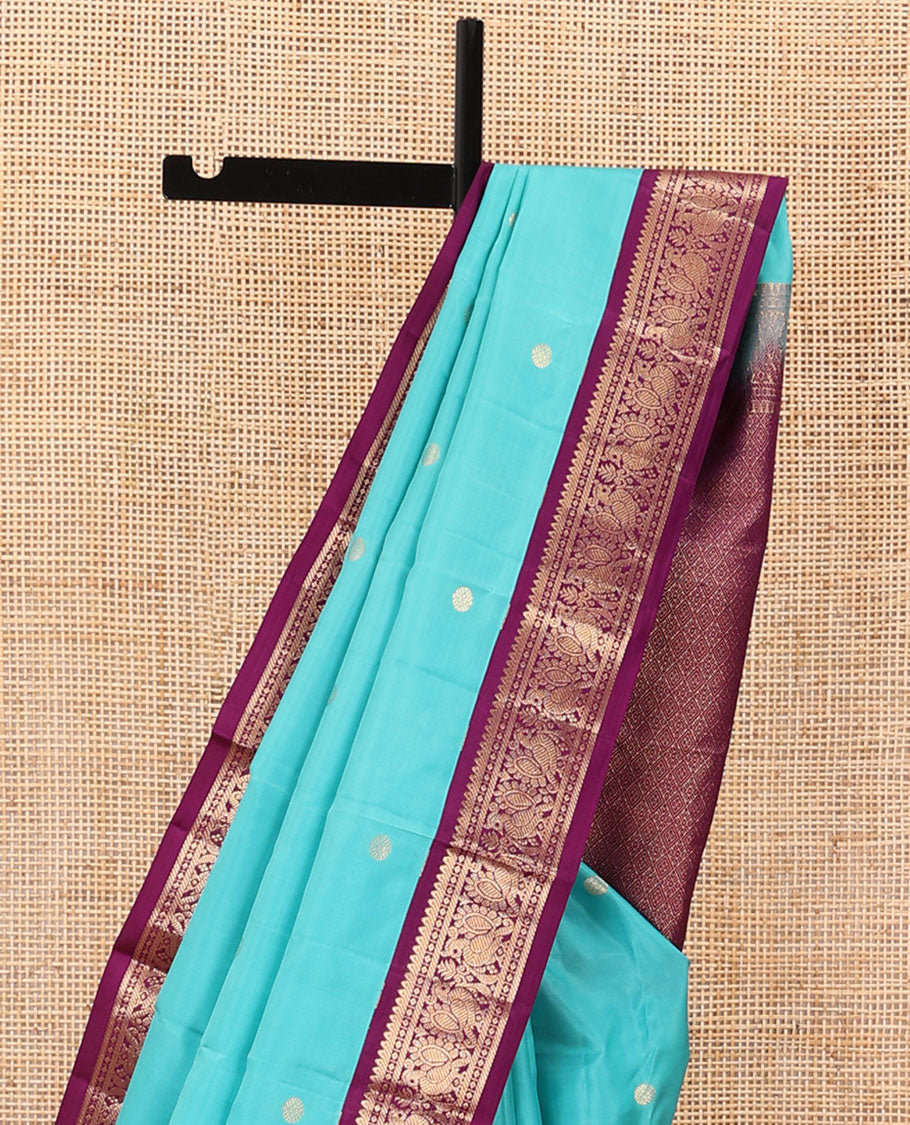 Light blue zari buttas silk saree, contrast border of rekku, diamond & mayil designs & jaal pallu