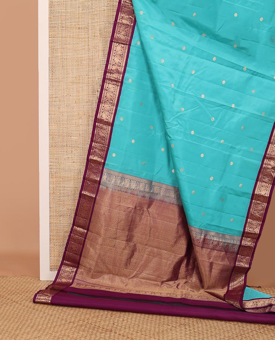 Light blue zari buttas silk saree, contrast border of rekku, diamond & mayil designs & jaal pallu